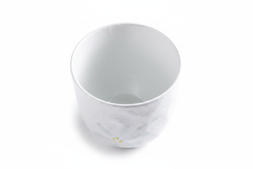 White ceramic Japanese tea cup 45 degree angle view
