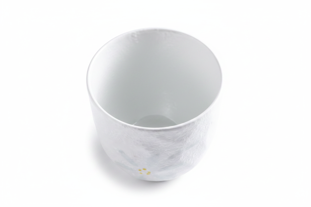White ceramic Japanese tea cup 45 degree angle view