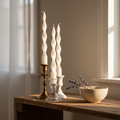 Three candles on rustic shelf with lavender