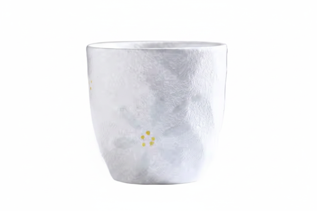 White ceramic Japanese tea cup side profile